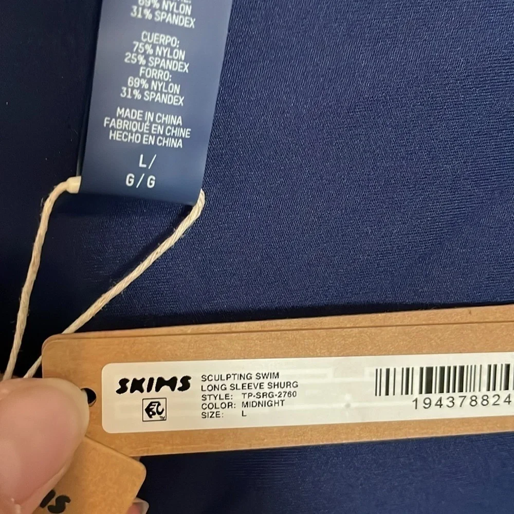 Skims sculpting swim long sleeve shrug.